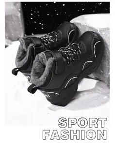 Detail shot of black children's winter sneakers with warm fleece lining in snow scene.