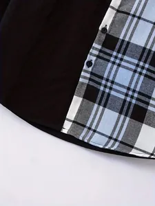 Close-up of men's casual color-block shirt showing plaid pattern and fabric texture.