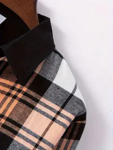 Detailed shot of men's plaid shirt shoulder featuring black lapel and orange check pattern