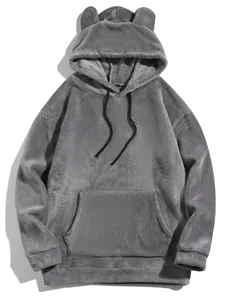 Close-up detail of soft grey coral fleece hoodie featuring cute bear ears and pocket