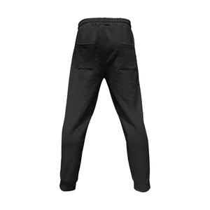 Vista trasera de pantalones deportivos negros con textura de jacquard en V y bolsillos
