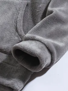 Close-up of the ultra-soft grey coral fleece texture on a men's hoodie sleeve detail.