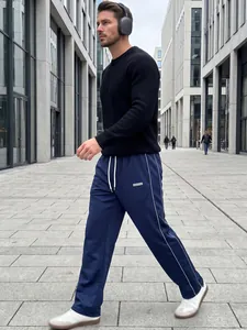 Full view of men's navy blue high street woven casual straight leg trousers with white stripes