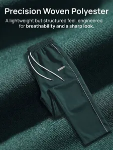 Close-up of dark green woven men's trousers showing material texture and drawstring.