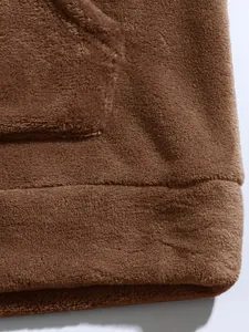 Detail view showing the soft and thick brown coral fleece texture of this men's hoodie