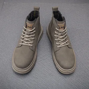 Top-down detail view of men's retro dark olive high-top work boots with thick soles
