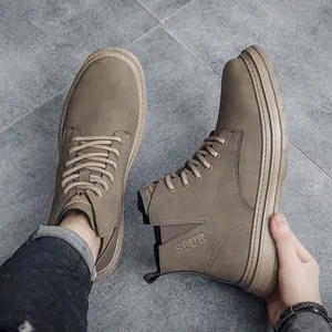 Close-up of men's vintage high-top work boots showing textured nubuck material and thick sole