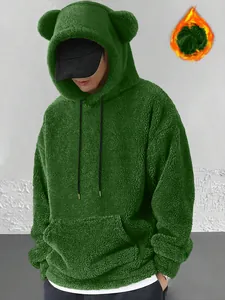 Close-up of green fuzzy bear-ear hoodie showcasing the soft coral velvet plush texture