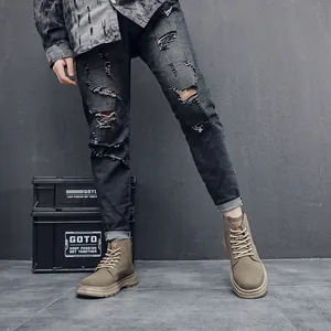 Close-up of retro khaki high-top men's Martin boots with thick soles in outdoor style