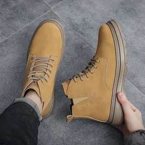 Detail view of mustard yellow high-top men's Martens boots with matte finish and SPUR logo