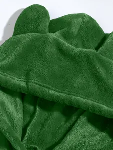 Macro detail showing the soft texture of a green coral fleece hoodie with cute ears