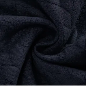 Primer plano de la tela con textura jacquard azul marino de primera para sudadera hombre