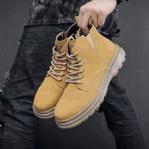Close-up view of men's mustard yellow retro work boots with thick durable soles.