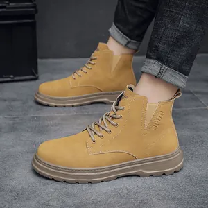 Detailed side view of tan nubuck high-top work boots for men with durable thick soles