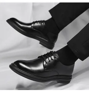 Close-up of men's black formal leather derby shoes with elegant textured finish.