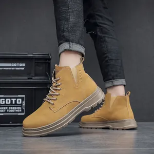 Detailed side view of mustard yellow vintage men's work boots featuring thick wear-resistant soles