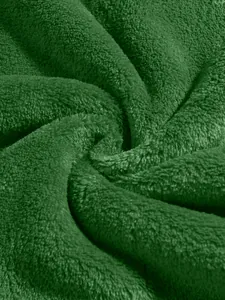 Macro detail view of the soft green coral fleece fabric texture for men's winter hoodies