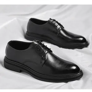 Detailed view of black textured leather derby shoes for formal business attire