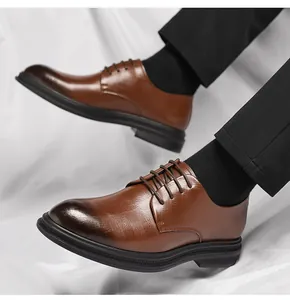 Close-up of men's brown business derby shoes with burnished toe and textured leather.