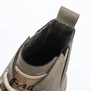 Close-up of retro men's Martin boots featuring cozy plaid lining and high-top collar detail.