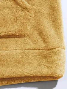 Detailed view of the ultra-soft coral fleece fabric texture on a camel men's hoodie jacket