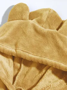 Close-up of fluffy coral fleece hood with cute animal ears on men's oversized jacket