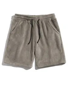 Detailed view of men's grey plush coral fleece lounge shorts with drawstring waist.