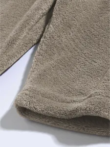 Detailed macro view showing the soft coral fleece texture of men's lounge shorts hem.
