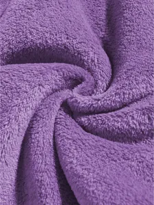High-quality close-up macro shot of soft purple coral fleece fabric texture details