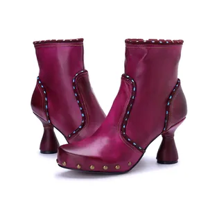 Elegant handmade burnished leather ankle boots with side zipper and flared heel details