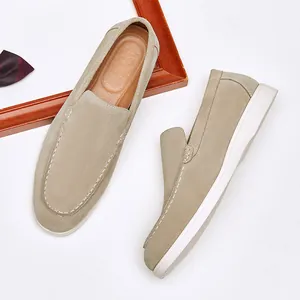 Men's beige suede slip-on loafers with white flat soles for a smart casual look
