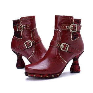 Vintage red leather women's ankle boots with floral patterns and side buckle details