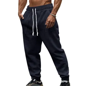 Close-up detail view of men's navy cable-knit drawstring joggers with casual sports fit