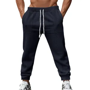 Men's navy blue knitted drawstring joggers with textured cable pattern for casual wear