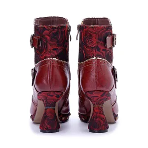 Back view of vintage handmade red leather boots with rose pattern heels and side zipper