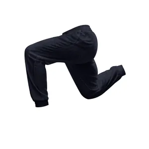 Detailed view of men's navy knit joggers featuring a braided texture in a dynamic pose