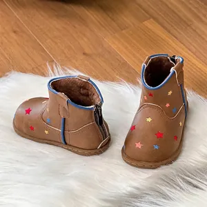 Detailed view of brown toddler boots with colorful star embroidery and rear zipper