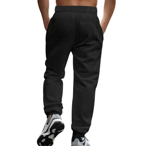 Detailed back view of men's black textured knit joggers showing pocket and fabric texture