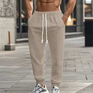 Stylish men's cable-knit casual joggers featuring a textured drawstring waist design.