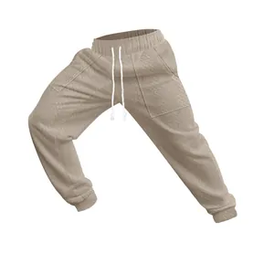 Macro view showing the intricate textured knit pattern of these beige men's drawstring joggers