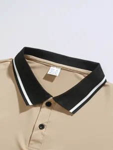 Close-up detail of a men's tan polo shirt with striped black collar and button placket.