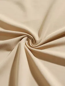 Macro detail view of beige breathable knit fabric for men's business polo shirt