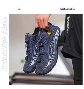 Close-up view of durable blue mesh outdoor water shoes held by hand for hiking and beach