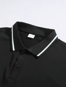 Close-up detail of a men's black polo shirt showing white striped collar and label