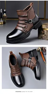Detail view of retro men's Chelsea boots featuring brown leather patchwork and metal buckle