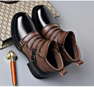 Detailed view of men's retro two-tone Chelsea boots with side zipper and strap.