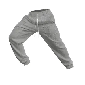 Close-up of grey men's cable knit joggers with white drawstring and ribbed cuffs