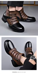 Close-up of men's leather Chelsea boots with color-block design and side zipper detail