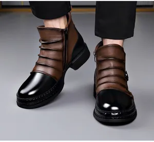 Detail of retro men's Chelsea boots with brown black patchwork and side zipper