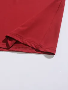 Close-up of red men's Polo shirt hem showing high-quality double-needle stitching detail
